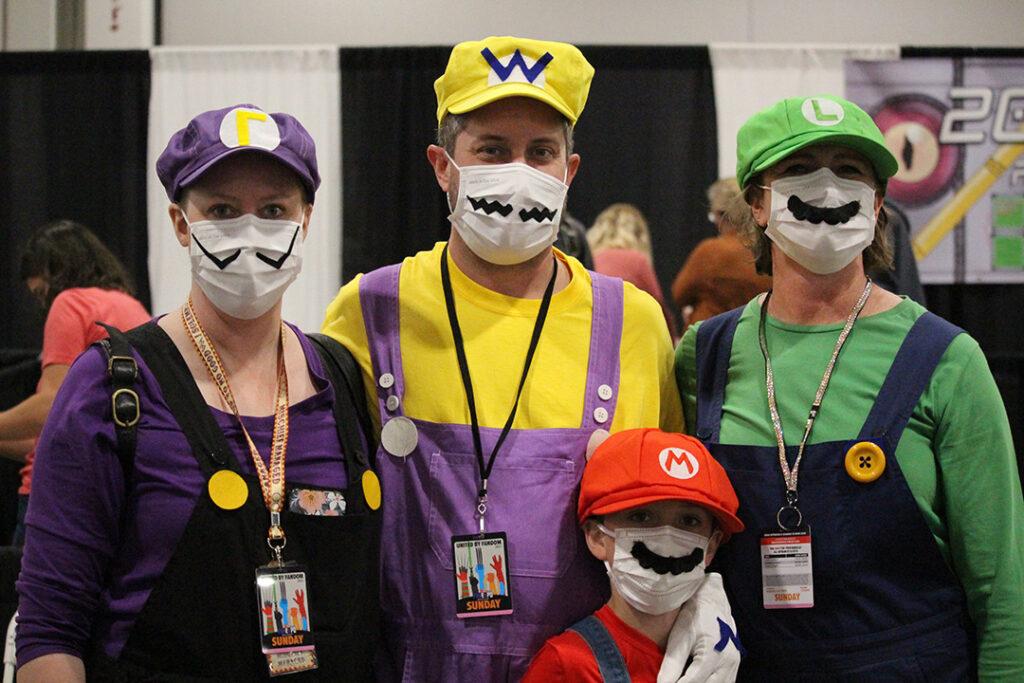 People in costume as Mario, Wario, Luigi, and Waluigi
