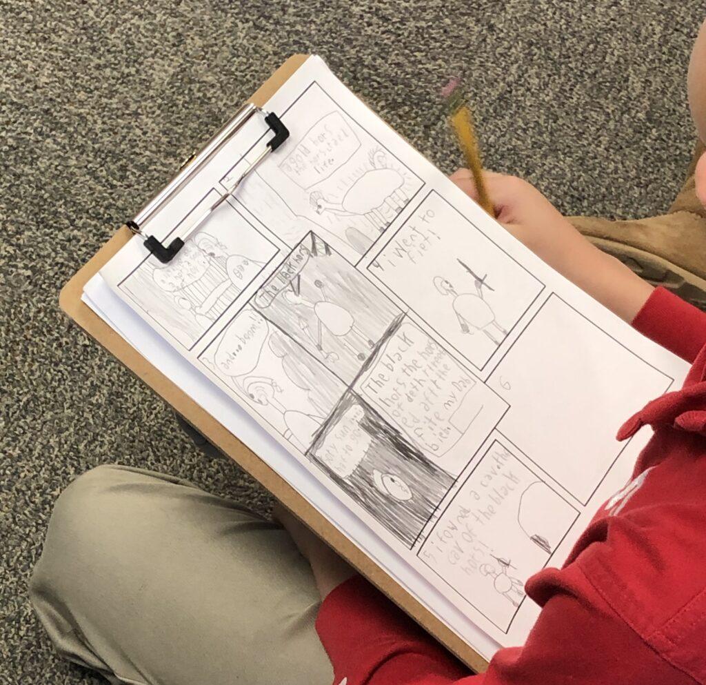 Photo: Student drawing a comic