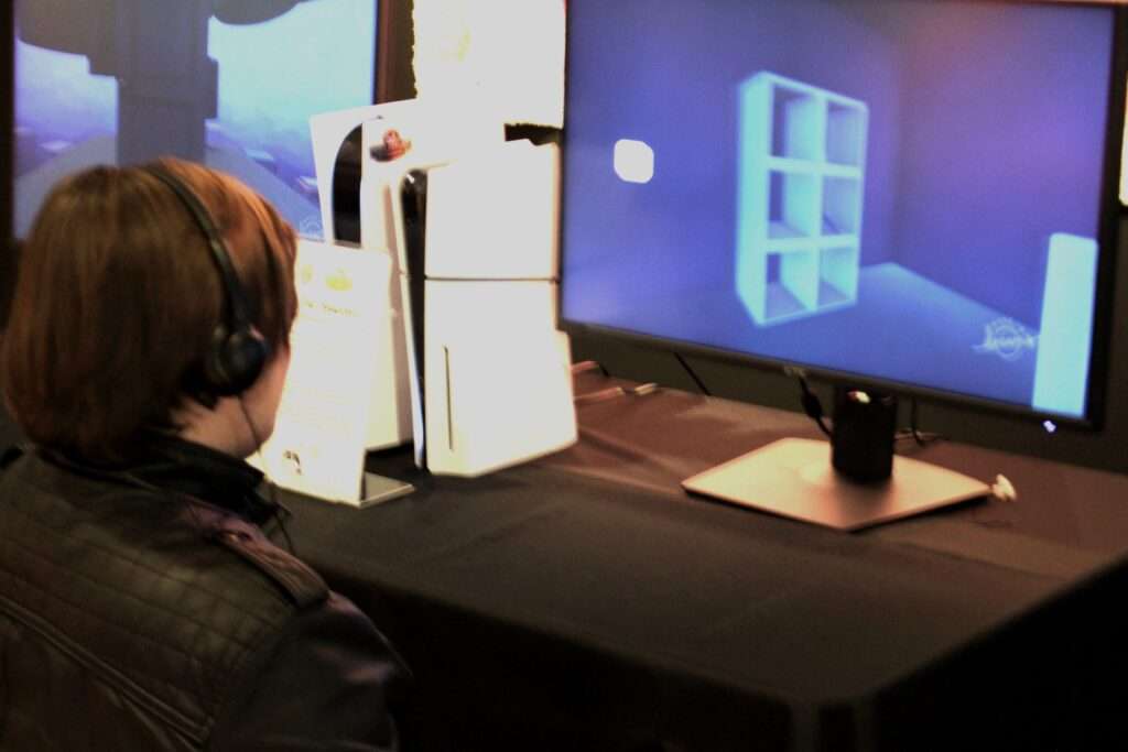 Testing a stuent-made game at the showcase